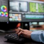 close up shot of video graphic editor using specialized software to edit movie footage